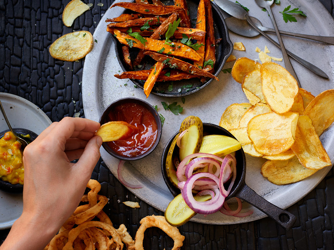 Deep fried onions with sweet potato fries on the side